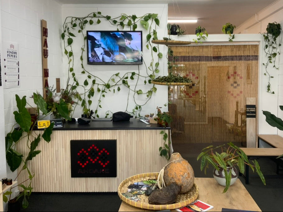Ahoake, Rongoa, Toi & Kakahu. Maori Kaupapa. Modern space for Mirimiri, Romiromi & Mahi a Wheua. With plants, a TV, and a reception desk, a clinic and a retail space and a workshop space.