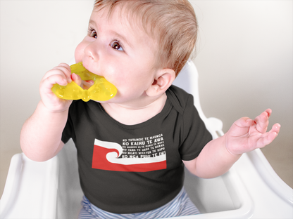 cute baby sitting in high chair wearing a custom pepeha onsie